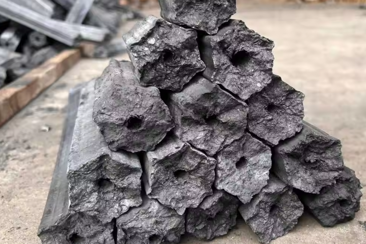 The 4-Step Sawdust Charcoal Manufacturing Process: From Drying to Carbonization 2 High-density hexagonal sawdust charcoal briquettes with a central hollow core for commercial BBQ