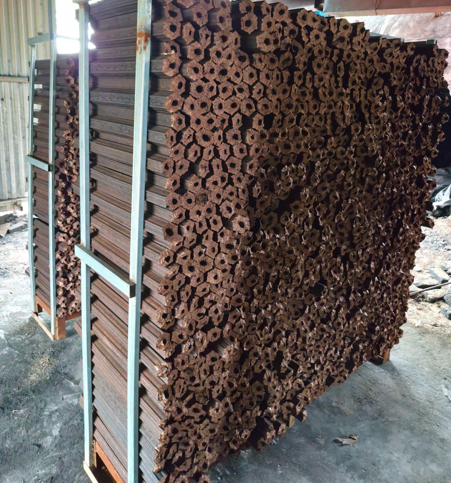 Bulk supply of industrial sawdust charcoal briquettes stacked for wholesale export