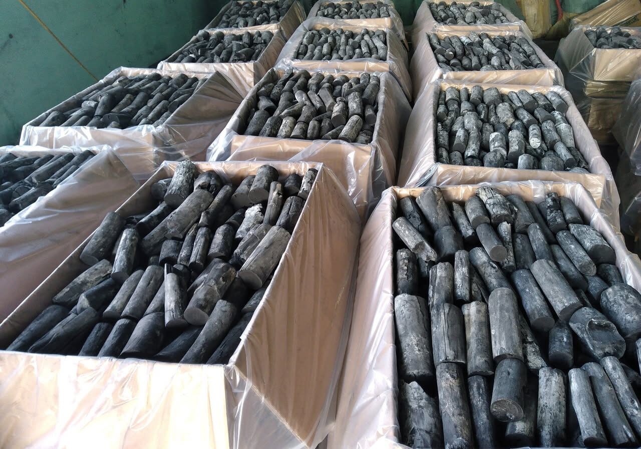 White Charcoal view of premium charcoal logs neatly packed in cardboard boxes for wholesale distribution