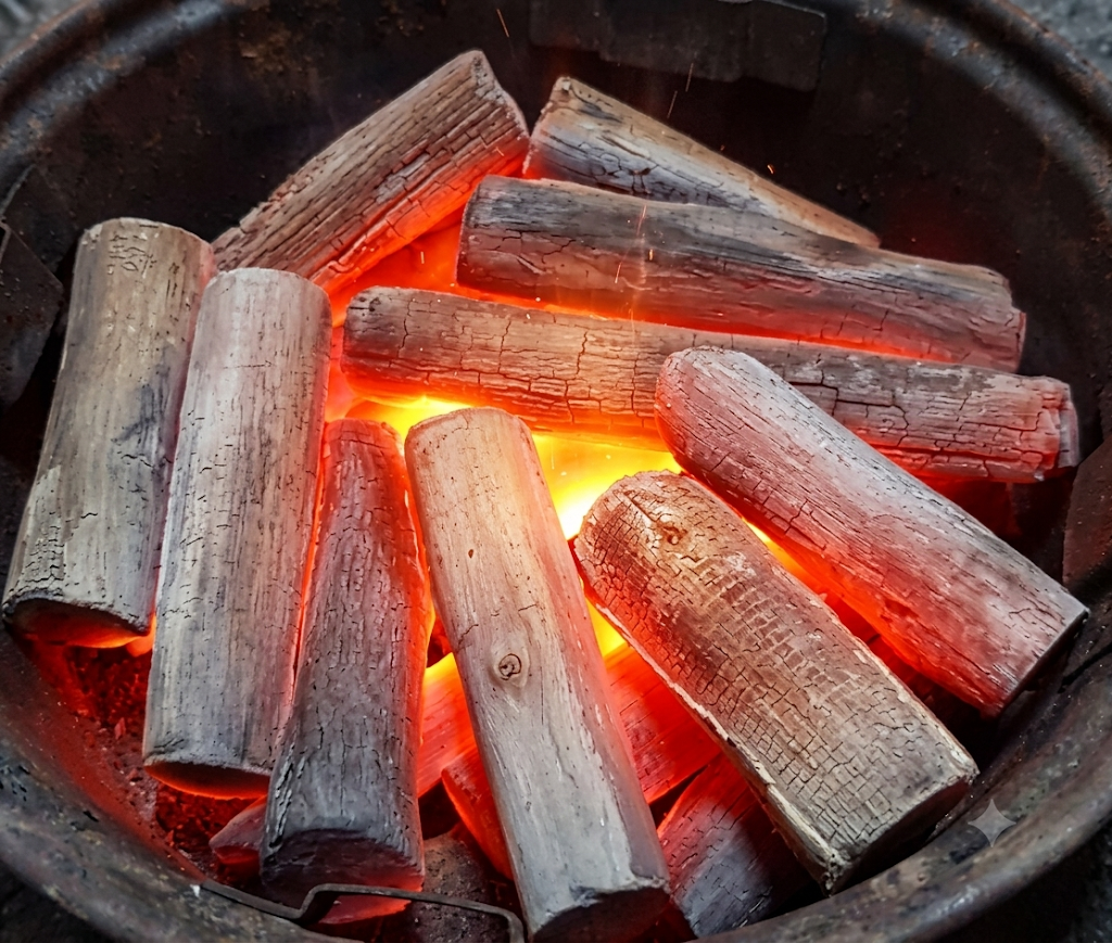 Burning test of authentic mangrove charcoal showing stable heat and minimal smoke